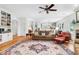 Spacious living room with built-in bookshelves, fireplace, area rug, and cozy seating area at 29 Morrison Ave, McClellanville, SC 29458