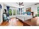 Serene main bedroom with hardwood floors, natural light, ceiling fan, and an inviting aesthetic at 29 Morrison Ave, McClellanville, SC 29458