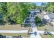 Aerial view of the two-story home, driveway, and manicured lawn, showcasing neighborhood and tree coverage at 2920 Newport Pl, North Charleston, SC 29420