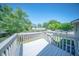 A white wood deck overlooks a well-maintained lawn and a surrounding fence creating private outdoor space at 2920 Newport Pl, North Charleston, SC 29420