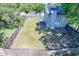 Fenced-in backyard with lawn, patio, chimney, deck and mature trees provides privacy at 2920 Newport Pl, North Charleston, SC 29420