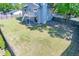 The spacious backyard features a well-maintained lawn, patio area and fence at 2920 Newport Pl, North Charleston, SC 29420