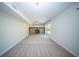 Large open basement space with a stone fireplace and access to the outdoors at 2920 Newport Pl, North Charleston, SC 29420