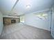 Bright basement featuring a stone fireplace and sliding glass doors to the backyard at 2920 Newport Pl, North Charleston, SC 29420