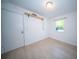 Empty bedroom shows neutral walls, luxury vinyl plank flooring, and a window at 2920 Newport Pl, North Charleston, SC 29420