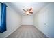 This bedroom features neutral carpet, white walls, and a ceiling fan with a light fixture at 2920 Newport Pl, North Charleston, SC 29420