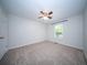 Bedroom with neutral carpet, white walls, window and ceiling fan with light fixture at 2920 Newport Pl, North Charleston, SC 29420