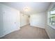 A cozy bedroom features neutral carpet, fresh paint, and ample natural light at 2920 Newport Pl, North Charleston, SC 29420