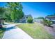 Well-maintained front yard with a neatly trimmed lawn, sidewalk access, and mature landscaping at 2920 Newport Pl, North Charleston, SC 29420