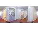 Hallway with view of carpeted bedrooms and bathroom with wood flooring and granite countertops at 2920 Newport Pl, North Charleston, SC 29420