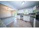 Well-lit kitchen featuring stainless steel appliances, white cabinets, and modern finishes at 2920 Newport Pl, North Charleston, SC 29420