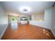 Open concept living room features hardwood floors and a modern light fixture at 2920 Newport Pl, North Charleston, SC 29420