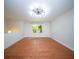 Open living space with beautiful hardwood floors, lots of natural light, and modern light fixture at 2920 Newport Pl, North Charleston, SC 29420