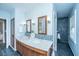 Elegant bathroom showcasing a double sink vanity, decorative tile, and modern lighting fixtures at 3 Lord Ashley Dr, Charleston, SC 29407