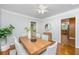 Bright dining room features hardwood floors, modern lighting, and seating for six, perfect for Gathering meals at 3 Lord Ashley Dr, Charleston, SC 29407