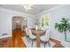 Bright dining room with hardwood floors, stylish table set, and ample natural light at 3 Lord Ashley Dr, Charleston, SC 29407