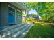 Charming home exterior features a blue front door, gray brick, and landscaped front yard at 3 Lord Ashley Dr, Charleston, SC 29407