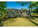 Home exterior with a lush green lawn and mature trees providing shade and curb appeal at 3 Lord Ashley Dr, Charleston, SC 29407