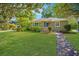 Beautiful home with brick walkway, manicured lawn, and shade trees at 3 Lord Ashley Dr, Charleston, SC 29407