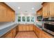 Well-lit kitchen features stainless appliances, ample counter space, and traditional style cabinetry at 3 Lord Ashley Dr, Charleston, SC 29407