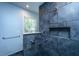 Contemporary tiled shower with a hand shower, rain shower head, and convenient recessed shelf at 3 Lord Ashley Dr, Charleston, SC 29407