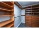 Spacious walk-in closet with custom wood shelving, drawers, and ample storage space at 3 Lord Ashley Dr, Charleston, SC 29407