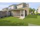 Inviting screened-in porch offering a relaxing outdoor living space with green backyard at 344 Flyway Rd, Goose Creek, SC 29445