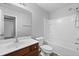 Bathroom featuring wood vanity, neutral paint and tile tub-shower at 344 Flyway Rd, Goose Creek, SC 29445