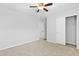 Bedroom features neutral carpet, ceiling fan, and closet access at 344 Flyway Rd, Goose Creek, SC 29445