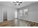 Bright bedroom featuring wood floors, an outdoor patio, and natural lighting from two windows at 344 Flyway Rd, Goose Creek, SC 29445