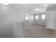 Open loft area with neutral carpeting and natural light at 344 Flyway Rd, Goose Creek, SC 29445