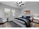 Elegantly furnished main bedroom with modern decor, wood floors, and plenty of natural light at 344 Flyway Rd, Goose Creek, SC 29445