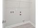 Functional laundry area with modern wood-look flooring, shelving, and hookups for washer and dryer at 354 Claret Cup Way, Charleston, SC 29414