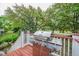 Outdoor deck with grill and views of the lush green backyard at 3567 Somerset Hills Ct, Mount Pleasant, SC 29466