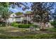 Charming backyard with mature trees and outdoor seating, perfect for relaxing or entertaining guests in a serene setting at 3567 Somerset Hills Ct, Mount Pleasant, SC 29466