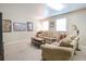 Spacious lower level features neutral colored sectional sofa and carpeted floors at 3567 Somerset Hills Ct, Mount Pleasant, SC 29466