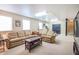 Comfortable living space featuring large sectional and access to staircase at 3567 Somerset Hills Ct, Mount Pleasant, SC 29466