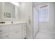 Cozy bathroom with white vanity, framed mirror, and tub with patterned shower curtain at 3567 Somerset Hills Ct, Mount Pleasant, SC 29466