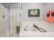 A soaking tub and glass-enclosed shower featuring clean white tile and chrome fixtures at 3567 Somerset Hills Ct, Mount Pleasant, SC 29466