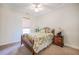 Cozy bedroom featuring a wooden bed frame, ceiling fan and neutral carpeting at 3567 Somerset Hills Ct, Mount Pleasant, SC 29466