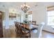 Elegant dining room featuring hardwood floors, decorative molding, and a stylish chandelier at 3567 Somerset Hills Ct, Mount Pleasant, SC 29466