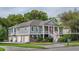 Charming two-story home featuring a welcoming front porch with stairs, garage, and landscaped lawn at 3567 Somerset Hills Ct, Mount Pleasant, SC 29466