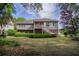 Charming two-story house featuring a well-manicured lawn and mature trees, offering serene curb appeal at 3567 Somerset Hills Ct, Mount Pleasant, SC 29466