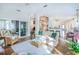 Bright living room with hardwood floors, wicker furniture, and access to porch at 3567 Somerset Hills Ct, Mount Pleasant, SC 29466
