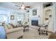 Bright living room showcasing a fireplace, custom built-ins, and views of backyard at 3567 Somerset Hills Ct, Mount Pleasant, SC 29466