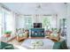 Bright living room with vaulted ceilings, wicker furniture, and many windows at 3567 Somerset Hills Ct, Mount Pleasant, SC 29466
