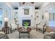 Elegant living room with fireplace, built-in shelving, and comfortable seating arrangement at 3567 Somerset Hills Ct, Mount Pleasant, SC 29466