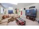 Cozy living room with plush sofa, entertainment center, and red accents at 3567 Somerset Hills Ct, Mount Pleasant, SC 29466
