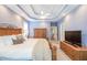 Main bedroom with a trey ceiling, ceiling fan, and wooden furniture at 3567 Somerset Hills Ct, Mount Pleasant, SC 29466