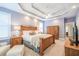 Main bedroom with a trey ceiling, ceiling fan, and wooden furniture at 3567 Somerset Hills Ct, Mount Pleasant, SC 29466